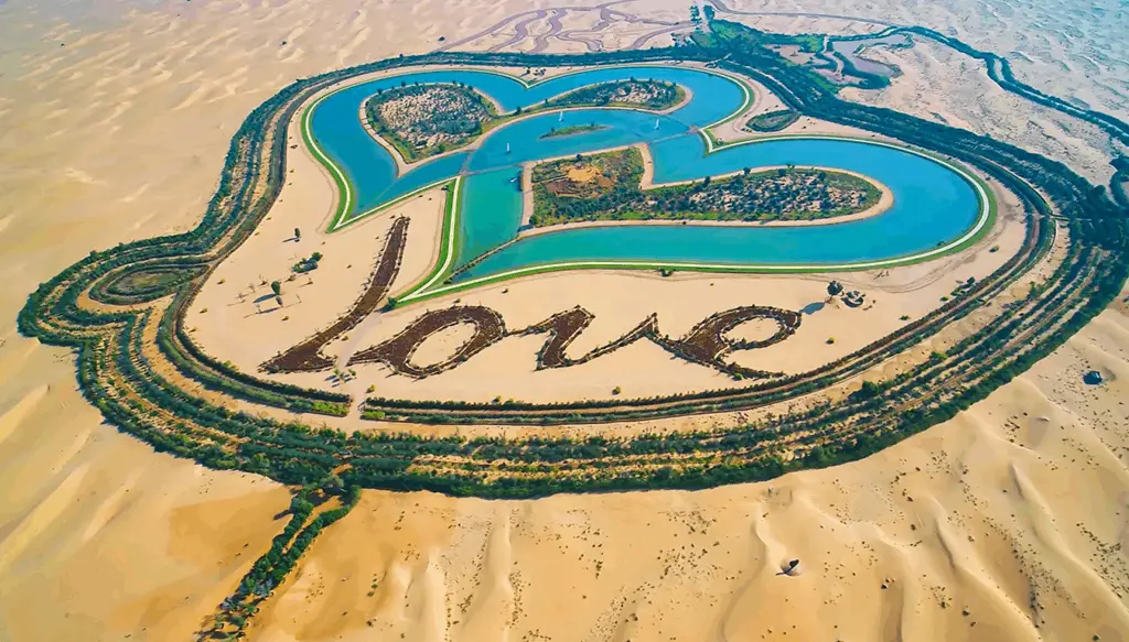Aerial view of an oasis in the desert and landscaping the forms the word Love